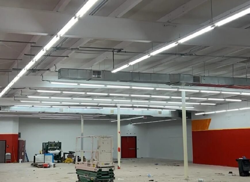 Warehouse ceiling with newly installed rows of LED lighting